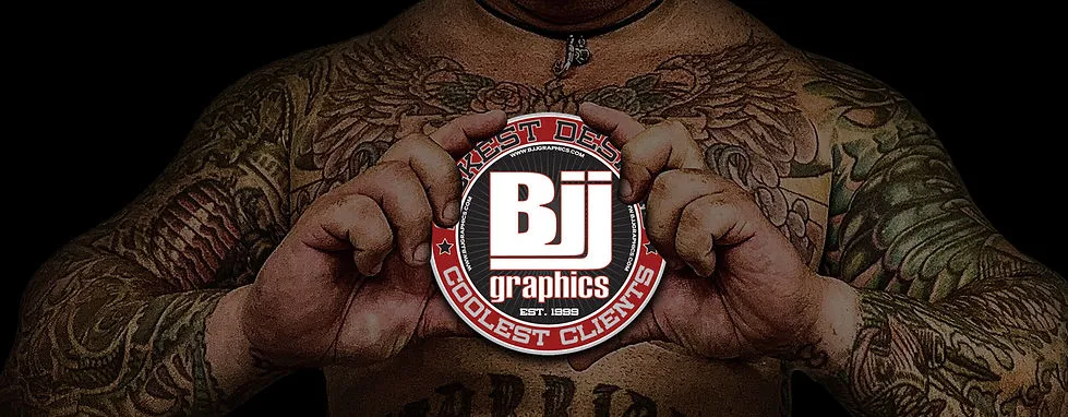 BJJ Graphics founder surrounded by custom apparel