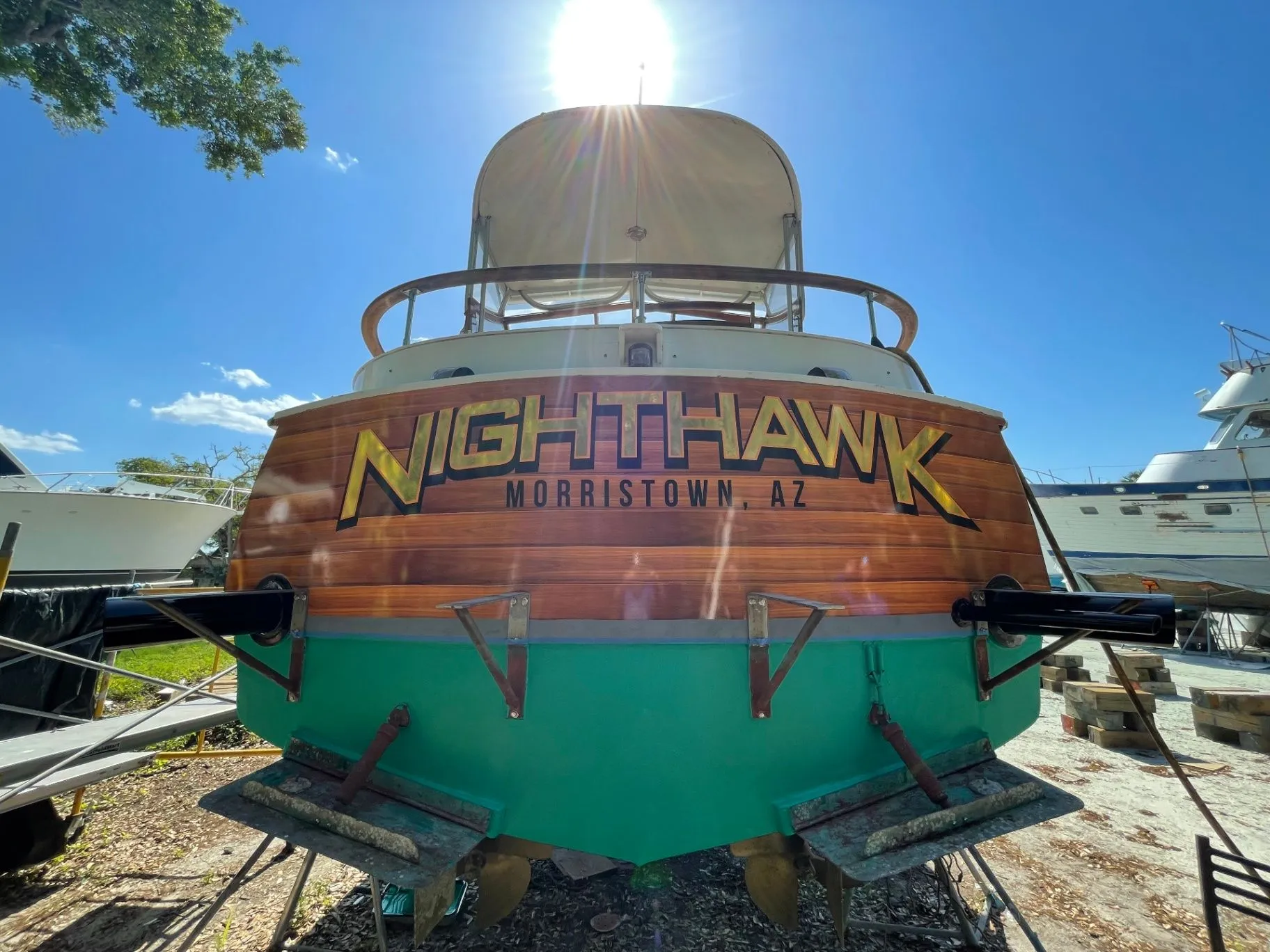 Nighthawk yacht transom with custom woodgrain name graphics